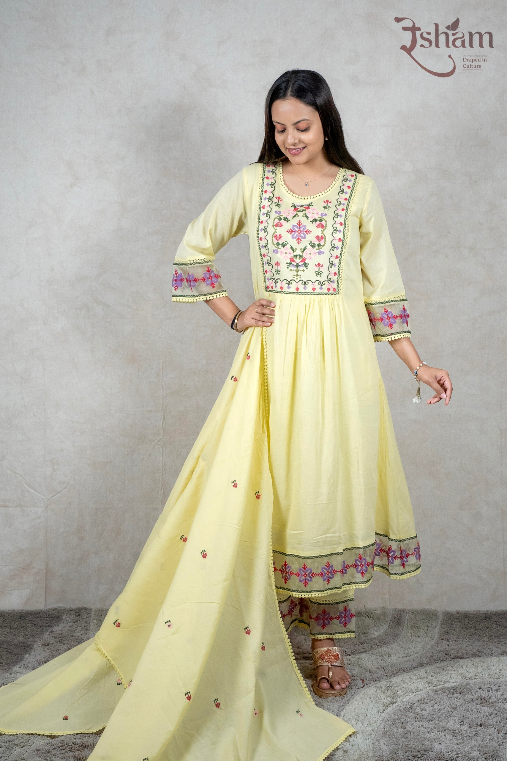 Raysham Fashion pastel yellow cotton kurta set with floral embroidery, lace detailing, and matching dupatta.