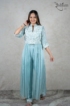 Raysham Fashion powder blue co-ord set with white floral embroidery, mandarin collar, and flared trousers.