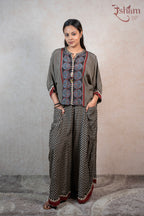 Raysham Fashion printed co-ord set with a geometric floral top and wide-leg trousers in black, red, and blue tones.