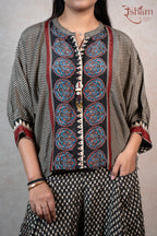 Raysham Fashion printed co-ord set featuring a black top with geometric patterns, floral motifs, and wide-leg trousers.