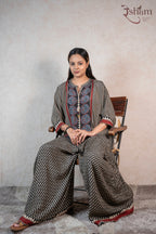 Raysham Fashion printed co-ord set with wide-leg trousers, featuring geometric patterns and floral motifs in black.