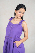 Raysham Fashion purple sleeveless midi dress with button-down bodice, tie-up straps, and lace trim details.