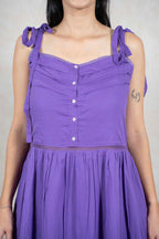 Raysham Fashion purple sleeveless midi dress with button-down bodice, tie-up straps, and delicate lace trim detailing.