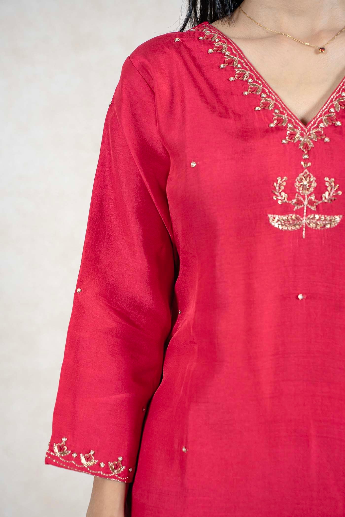 Raysham Fashion crimson red silk-blend kurta featuring intricate gold embroidery on the V-neckline and sleeves.