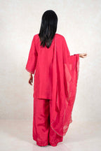 Raysham Fashion crimson red silk-blend kurta set with palazzo pants and sheer dupatta, back view with gold embroidery.