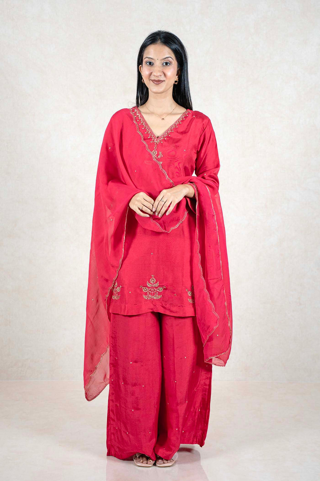 Raysham Fashion crimson red silk-blend kurta set with gold embroidery, palazzo pants, and a matching sheer dupatta.