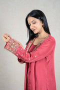 Raysham Fashion rose-pink jacket with intricate gold embroidery on cuffs and lapels worn by a woman