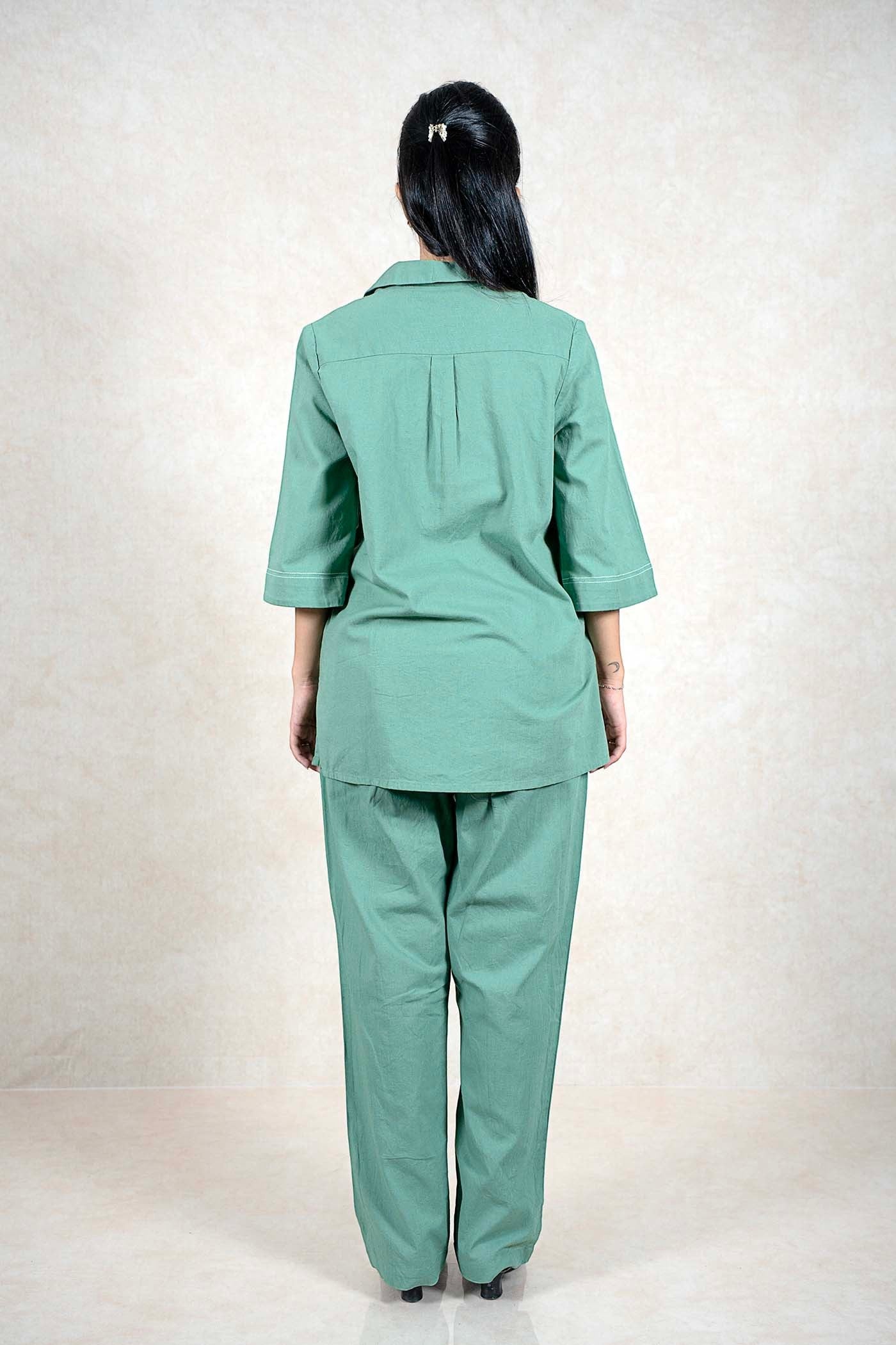 Back view of a woman wearing a Raysham Fashion sage green two-piece co-ord set with three-quarter sleeves