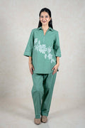 Raysham Fashion sage green two-piece co-ord set with zip-neck tunic, floral embroidery, and relaxed-fit trousers.