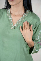 Raysham Fashion sage green silk kurta featuring a V-neckline with intricate floral embroidery and delicate beadwork