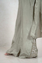 Raysham Fashion sage green silk co-ord set with wide-leg trousers and delicate floral embroidery on the hem