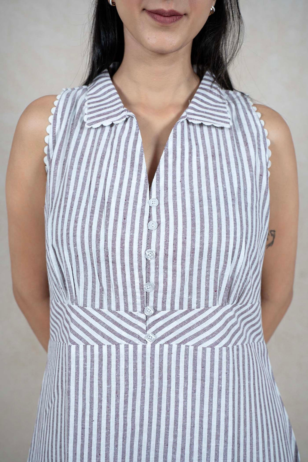 Raysham Fashion sleeveless midi dress with vertical stripes, a structured collar, and scalloped armhole trim.