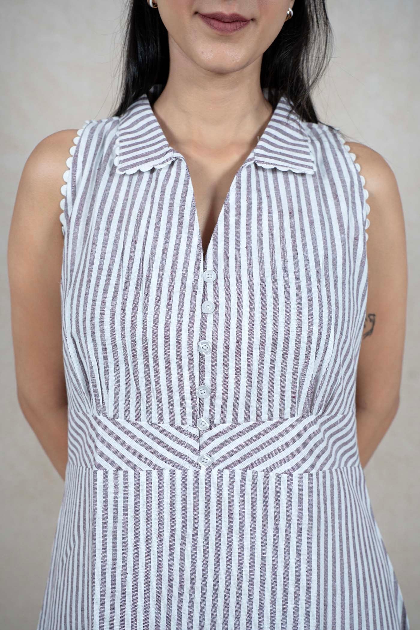 Raysham Fashion sleeveless midi dress with vertical stripes, a structured collar, and scalloped armhole trim.
