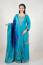 Raysham Fashion teal silk kurta set with multi-colored embroidery and an ombre blue dupatta with silver foil work.