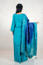 Raysham Fashion teal silk kurta set with wide-leg trousers and an ombre blue dupatta featuring silver foil work.