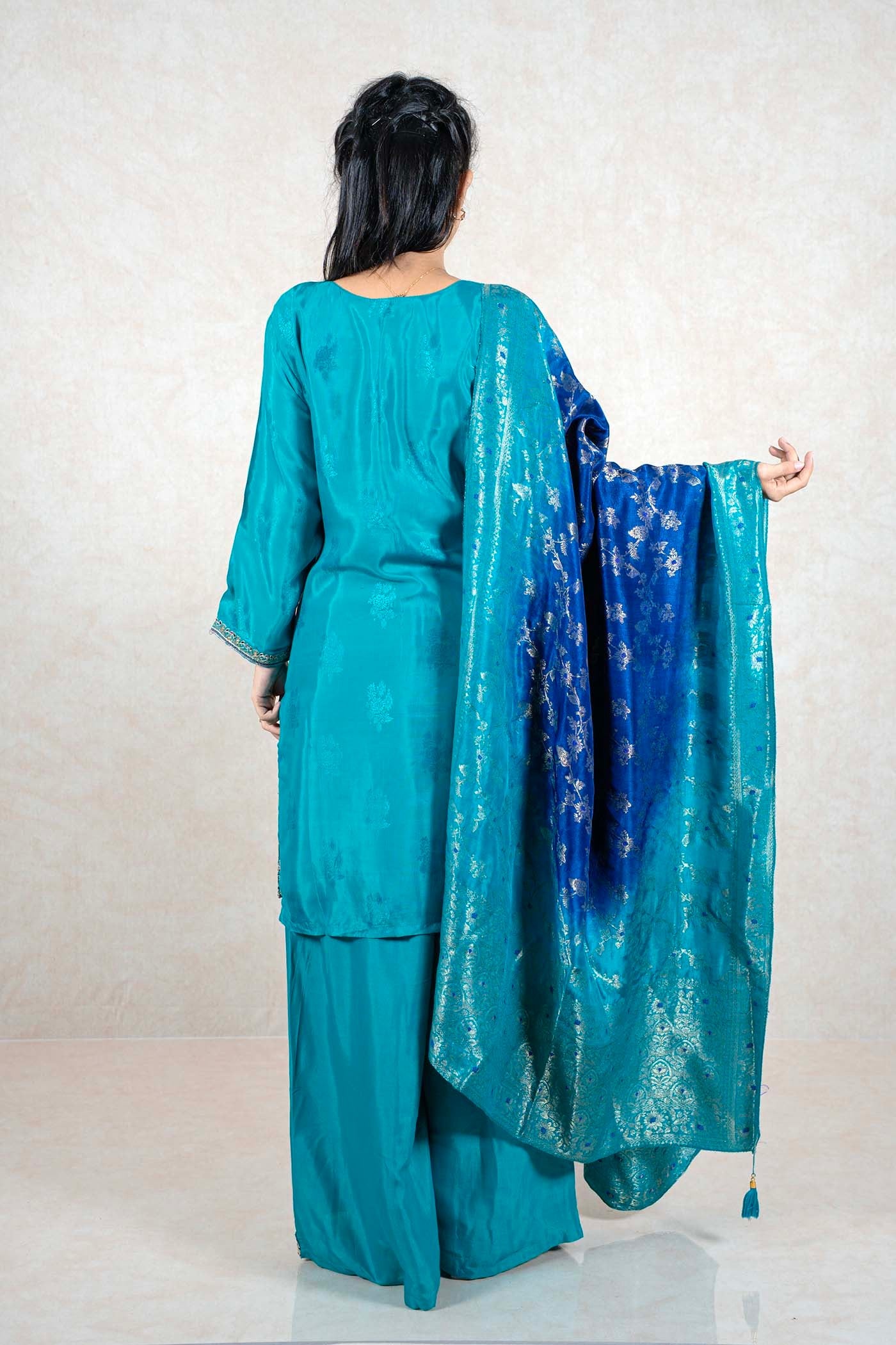 Raysham Fashion teal silk kurta set with wide-leg trousers and an ombre blue dupatta featuring silver foil work.
