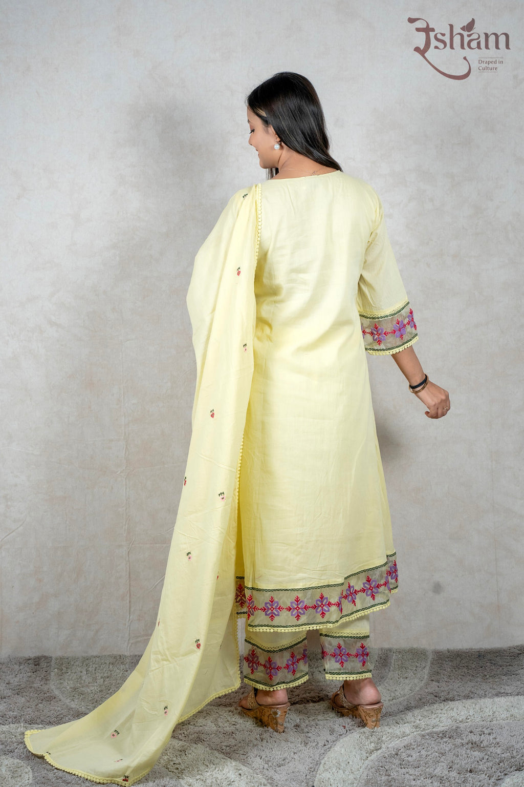 Raysham Fashion pastel yellow cotton kurta set with floral embroidery, lace trim, and matching dupatta, back view.